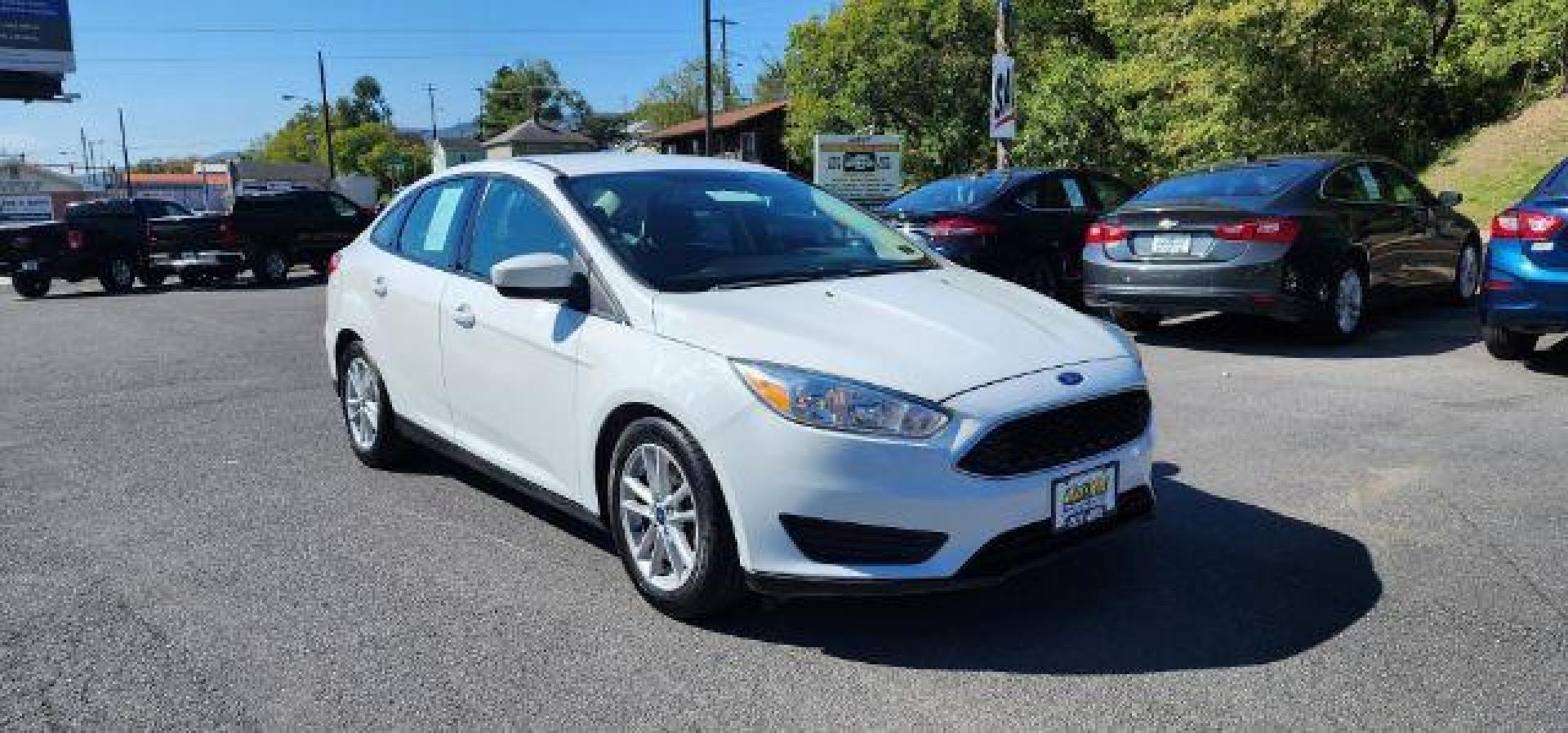 2018 WHITE /Charcoal Black Insert w/Warm Steel Surround, cloth Ford Focus SE Sedan (1FADP3F24JL) with an 2.0L L4 engine, AT transmission, located at 353 S. Mineral St., Keyser, WV, 26726, (304) 788-7887, 39.436451, -78.981674 - Photo#0