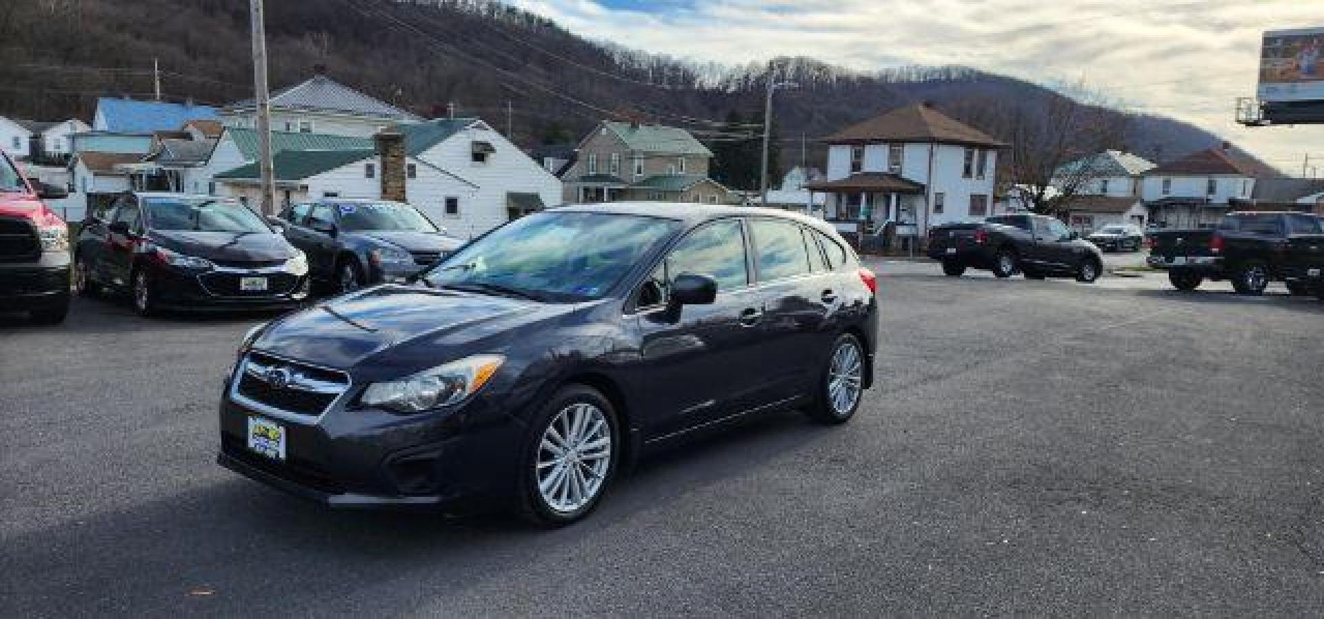 2012 GRAY /Black Cloth Interior Subaru Impreza Premium Plus 5-Door+S/R (JF1GPAD6XCH) with an 2.0L L4 engine, CVT transmission, located at 353 S. Mineral St., Keyser, WV, 26726, (304) 788-7887, 39.436451, -78.981674 - Photo#2