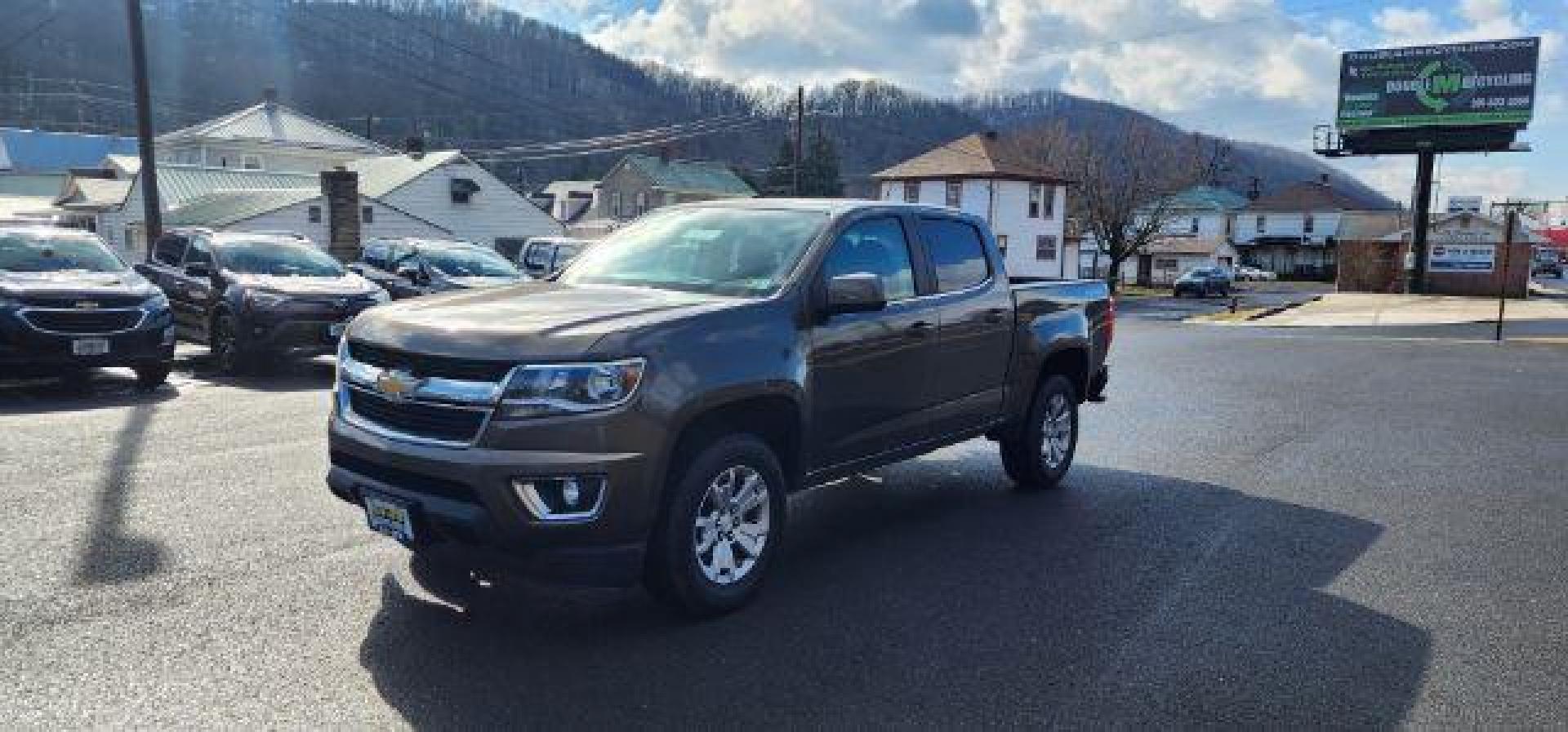 2015 BROWN /Jet Black Chevrolet Colorado LT Crew Cab 4WD Short Box (1GCGTBE37F1) with an 3.6L V6 engine, AT transmission, located at 353 S. Mineral St., Keyser, WV, 26726, (304) 788-7887, 39.436451, -78.981674 - Photo#1