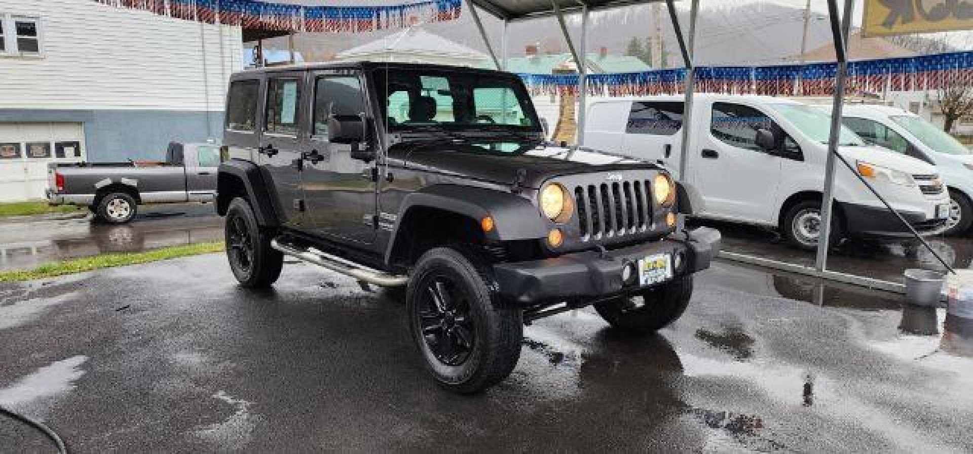 2014 GRAY /Black Jeep Wrangler Unlimited Sport 4WD (1C4BJWDG8EL) with an 3.6L V6 engine, AT transmission, located at 353 S. Mineral St., Keyser, WV, 26726, (304) 788-7887, 39.436451, -78.981674 - FOR A BETTER PRICE CALL PAUL AT 301-268-8150 - Photo#0