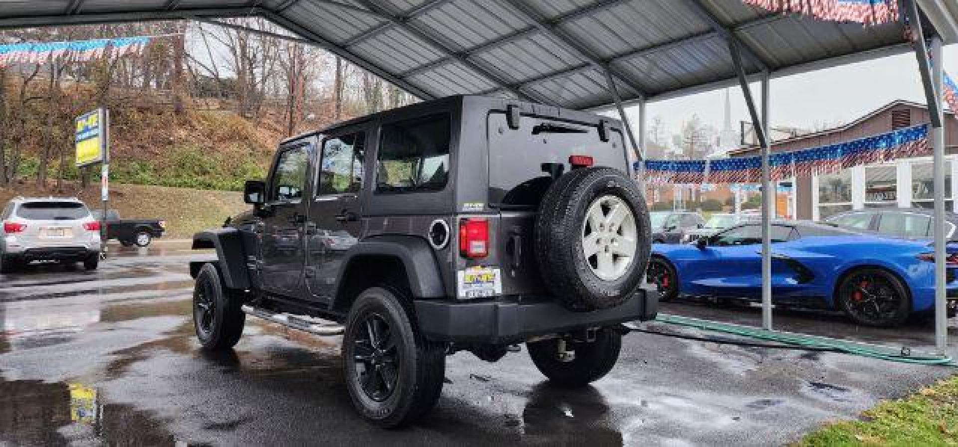 2014 GRAY /Black Jeep Wrangler Unlimited Sport 4WD (1C4BJWDG8EL) with an 3.6L V6 engine, AT transmission, located at 353 S. Mineral St., Keyser, WV, 26726, (304) 788-7887, 39.436451, -78.981674 - FOR A BETTER PRICE CALL PAUL AT 301-268-8150 - Photo#9