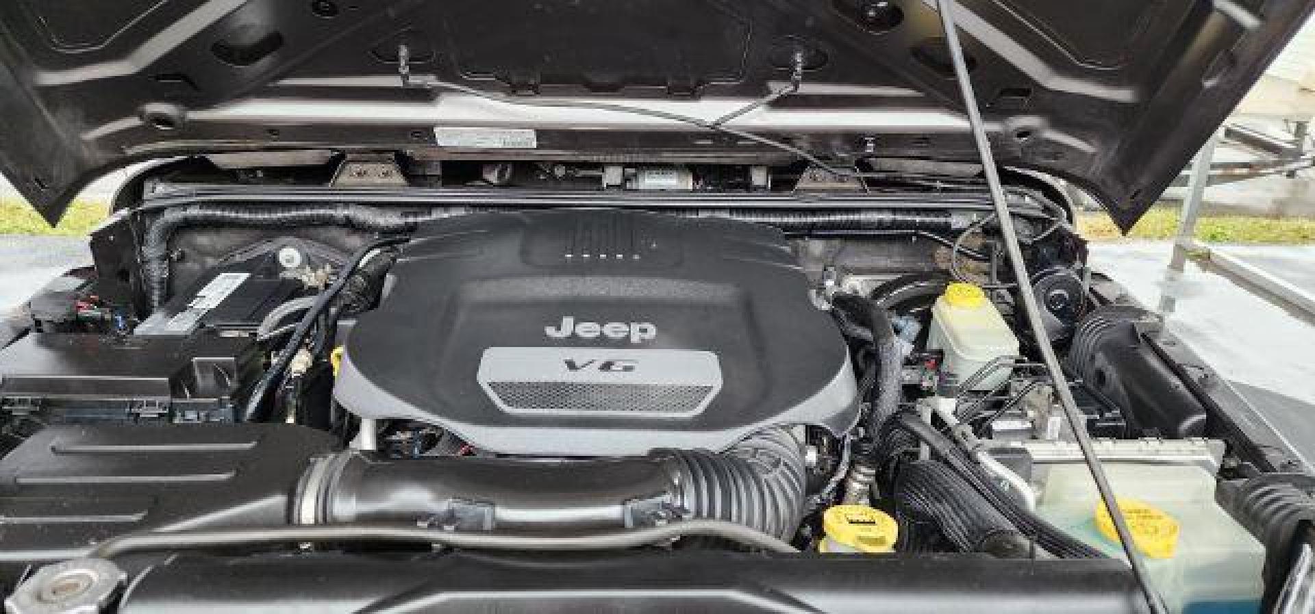 2014 GRAY /Black Jeep Wrangler Unlimited Sport 4WD (1C4BJWDG8EL) with an 3.6L V6 engine, AT transmission, located at 353 S. Mineral St., Keyser, WV, 26726, (304) 788-7887, 39.436451, -78.981674 - FOR A BETTER PRICE CALL PAUL AT 301-268-8150 - Photo#16