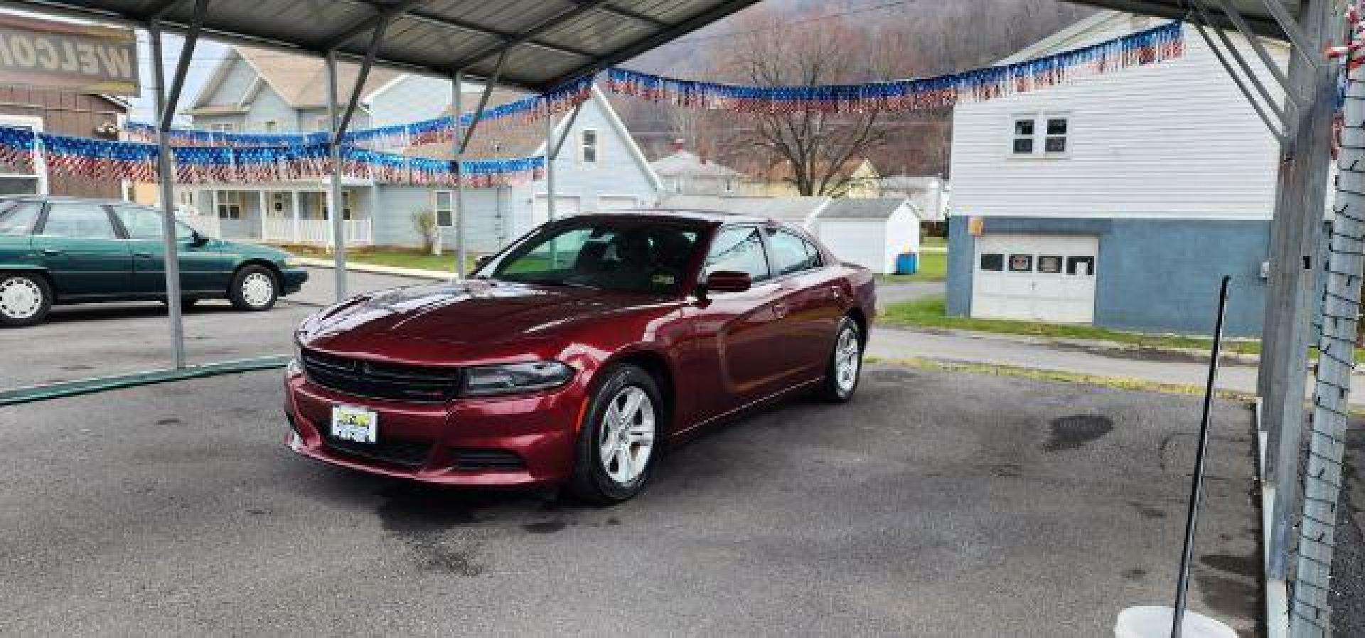 2021 Maroon /Black, premium leather Dodge Charger SXT (2C3CDXBG4MH) with an 3.6L V6 engine, AT transmission, located at 353 S. Mineral St., Keyser, WV, 26726, (304) 788-7887, 39.436451, -78.981674 - Photo#2