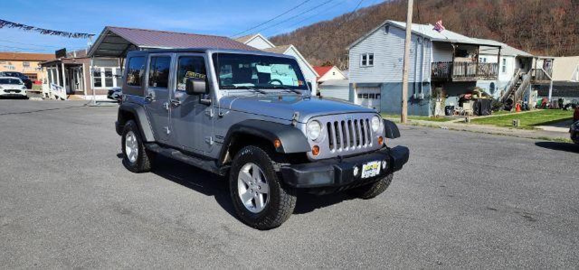 2013 Silver /Black Cloth Interior Jeep Wrangler Unlimited Sport 4WD (1C4BJWDG6DL) with an 3.6L V6 engine, AT transmission, located at 353 S. Mineral St., Keyser, WV, 26726, (304) 788-7887, 39.436451, -78.981674 - FOR A BETTER PRICE CALL PAUL AT 301-268-8150 - Photo#0