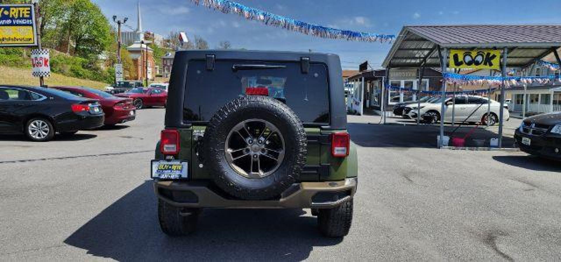 2016 GREEN /Leather Black Jeep Wrangler Unlimited Sahara 4WD (1C4BJWEG8GL) with an 3.6L V6 engine, AT transmission, located at 353 S. Mineral St., Keyser, WV, 26726, (304) 788-7887, 39.436451, -78.981674 - Photo#9