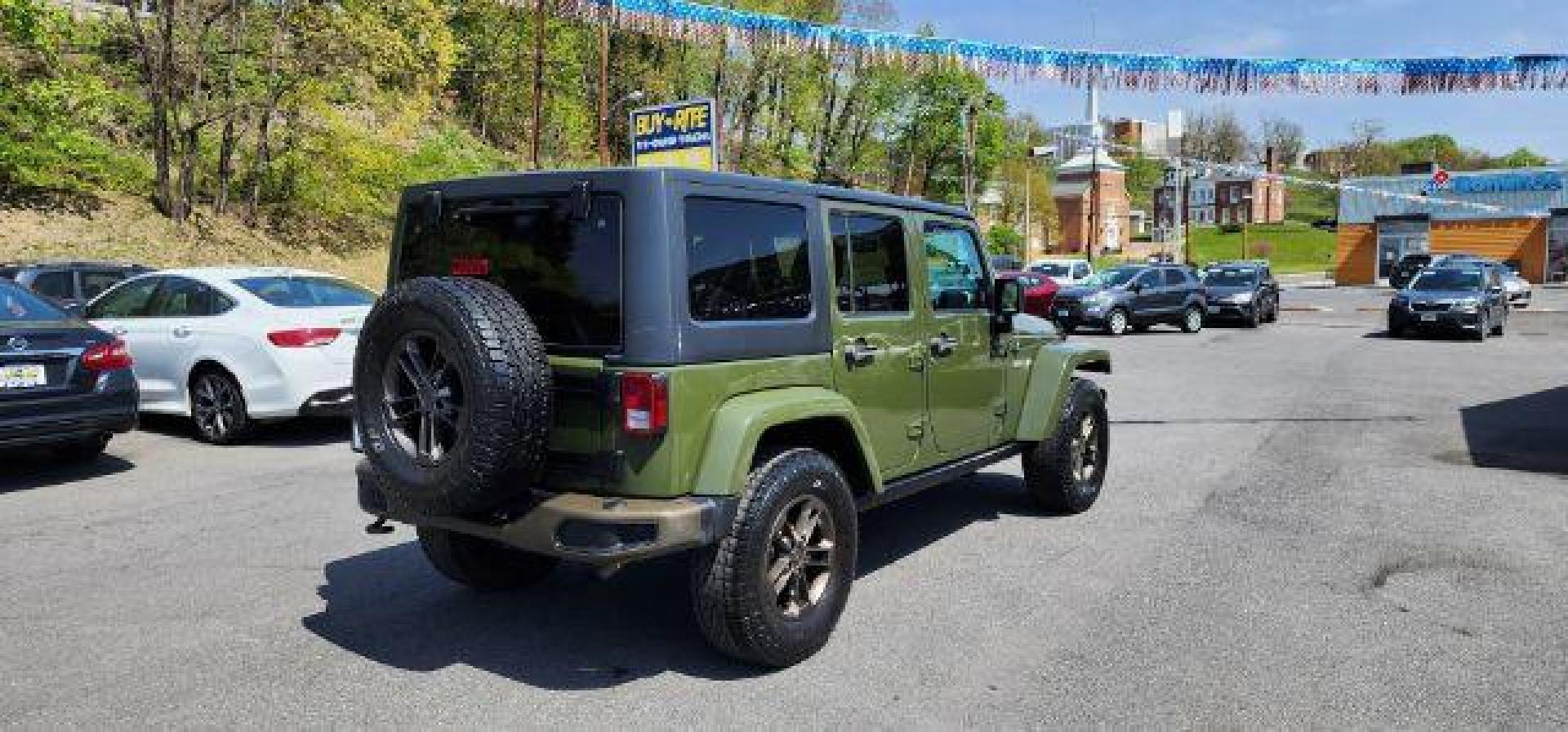 2016 GREEN /Leather Black Jeep Wrangler Unlimited Sahara 4WD (1C4BJWEG8GL) with an 3.6L V6 engine, AT transmission, located at 353 S. Mineral St., Keyser, WV, 26726, (304) 788-7887, 39.436451, -78.981674 - Photo#11