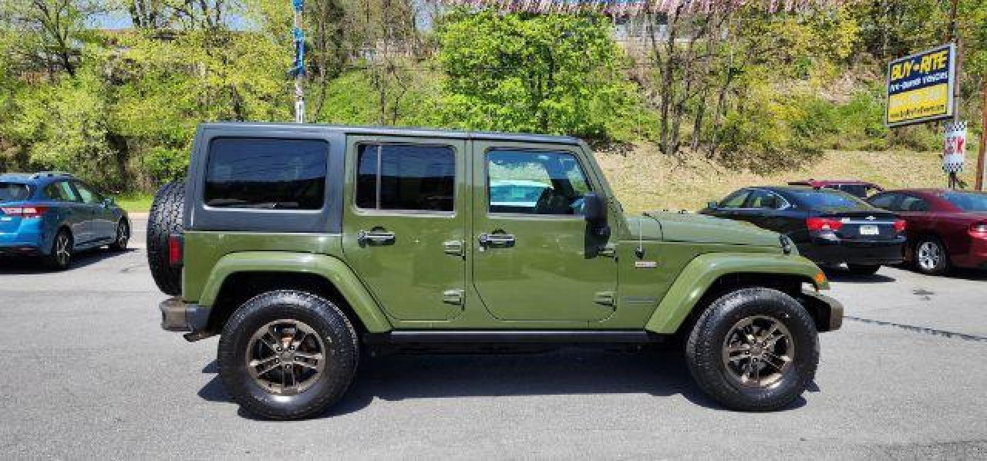 2016 GREEN /Leather Black Jeep Wrangler Unlimited Sahara 4WD (1C4BJWEG8GL) with an 3.6L V6 engine, AT transmission, located at 353 S. Mineral St., Keyser, WV, 26726, (304) 788-7887, 39.436451, -78.981674 - Photo#12