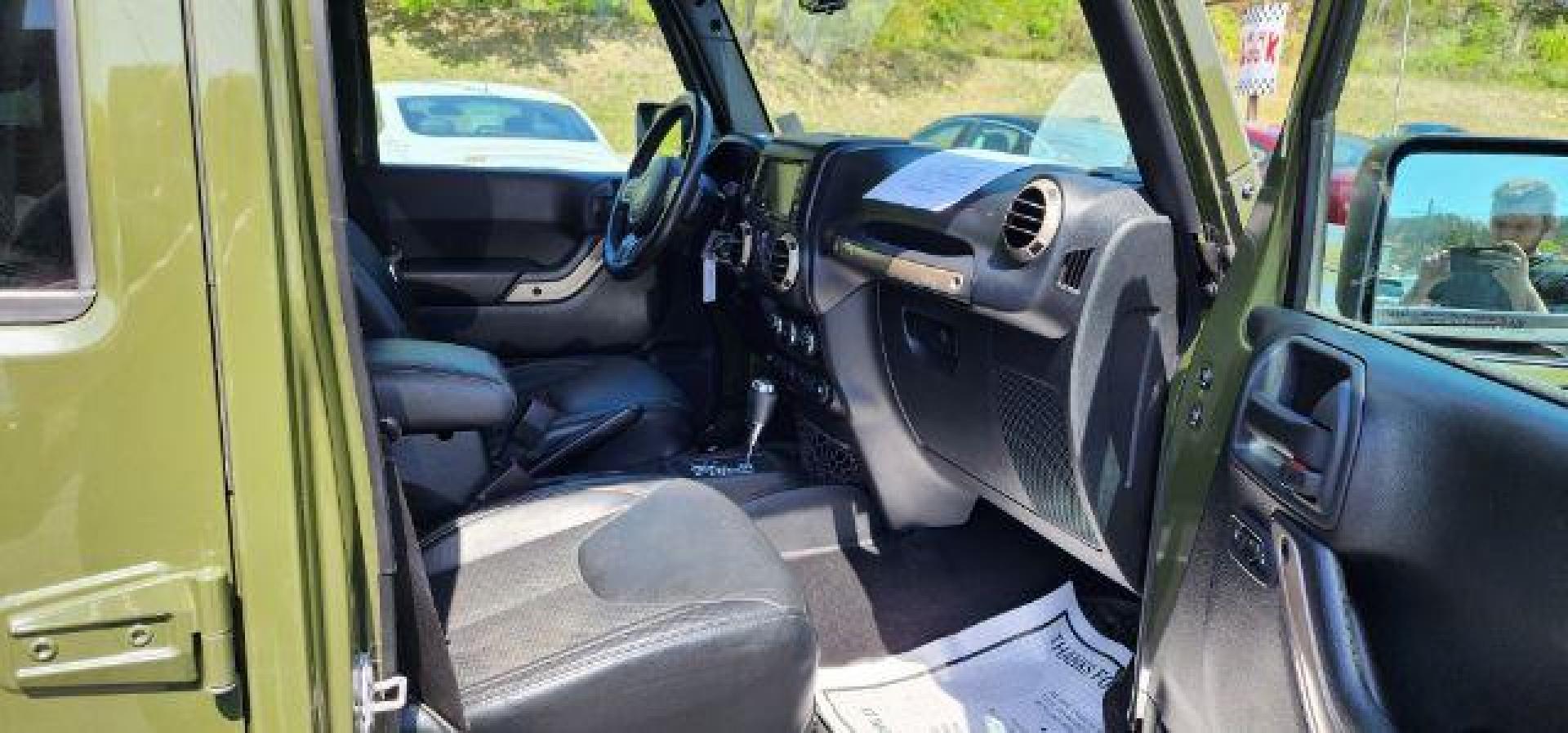 2016 GREEN /Leather Black Jeep Wrangler Unlimited Sahara 4WD (1C4BJWEG8GL) with an 3.6L V6 engine, AT transmission, located at 353 S. Mineral St., Keyser, WV, 26726, (304) 788-7887, 39.436451, -78.981674 - Photo#14
