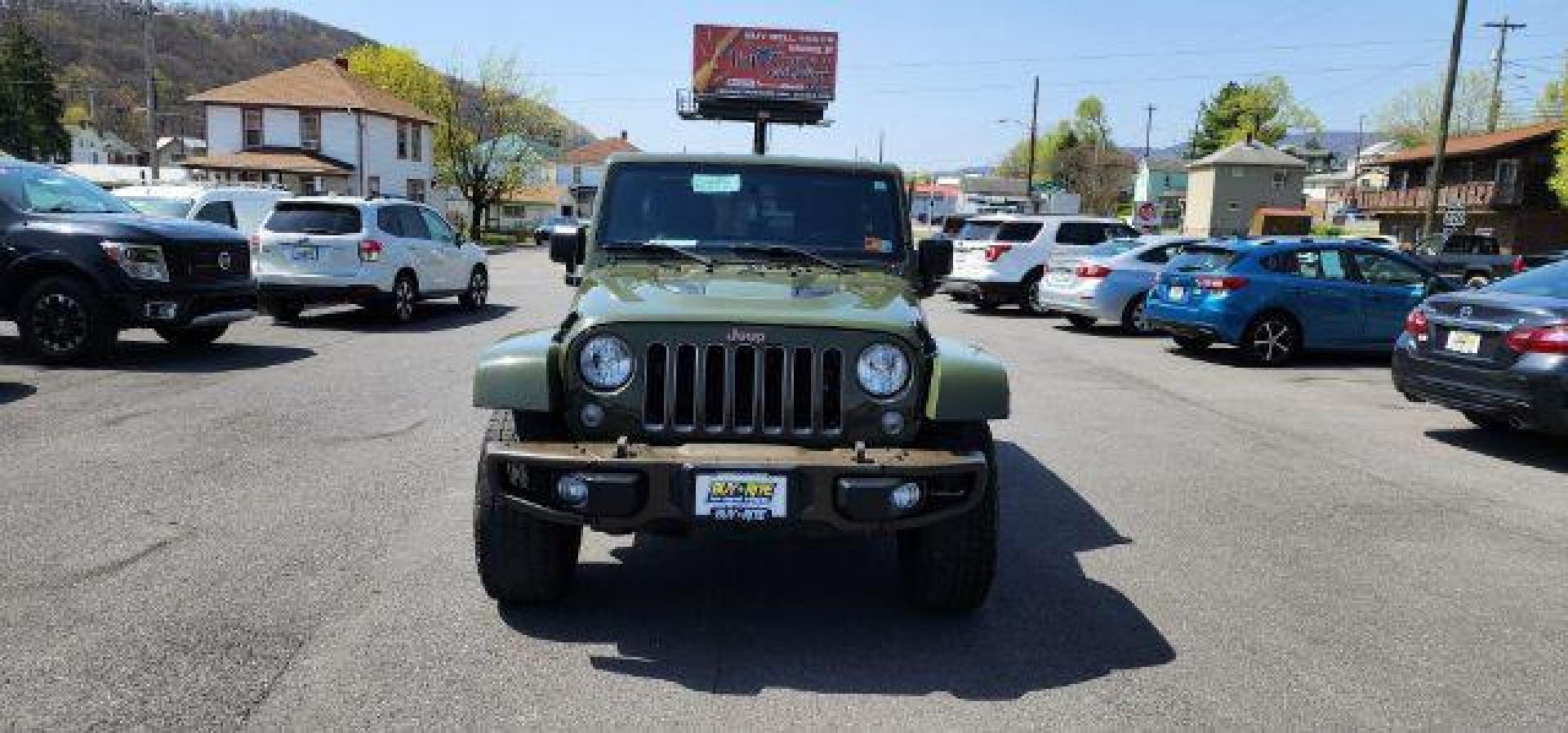 2016 GREEN /Leather Black Jeep Wrangler Unlimited Sahara 4WD (1C4BJWEG8GL) with an 3.6L V6 engine, AT transmission, located at 353 S. Mineral St., Keyser, WV, 26726, (304) 788-7887, 39.436451, -78.981674 - Photo#1