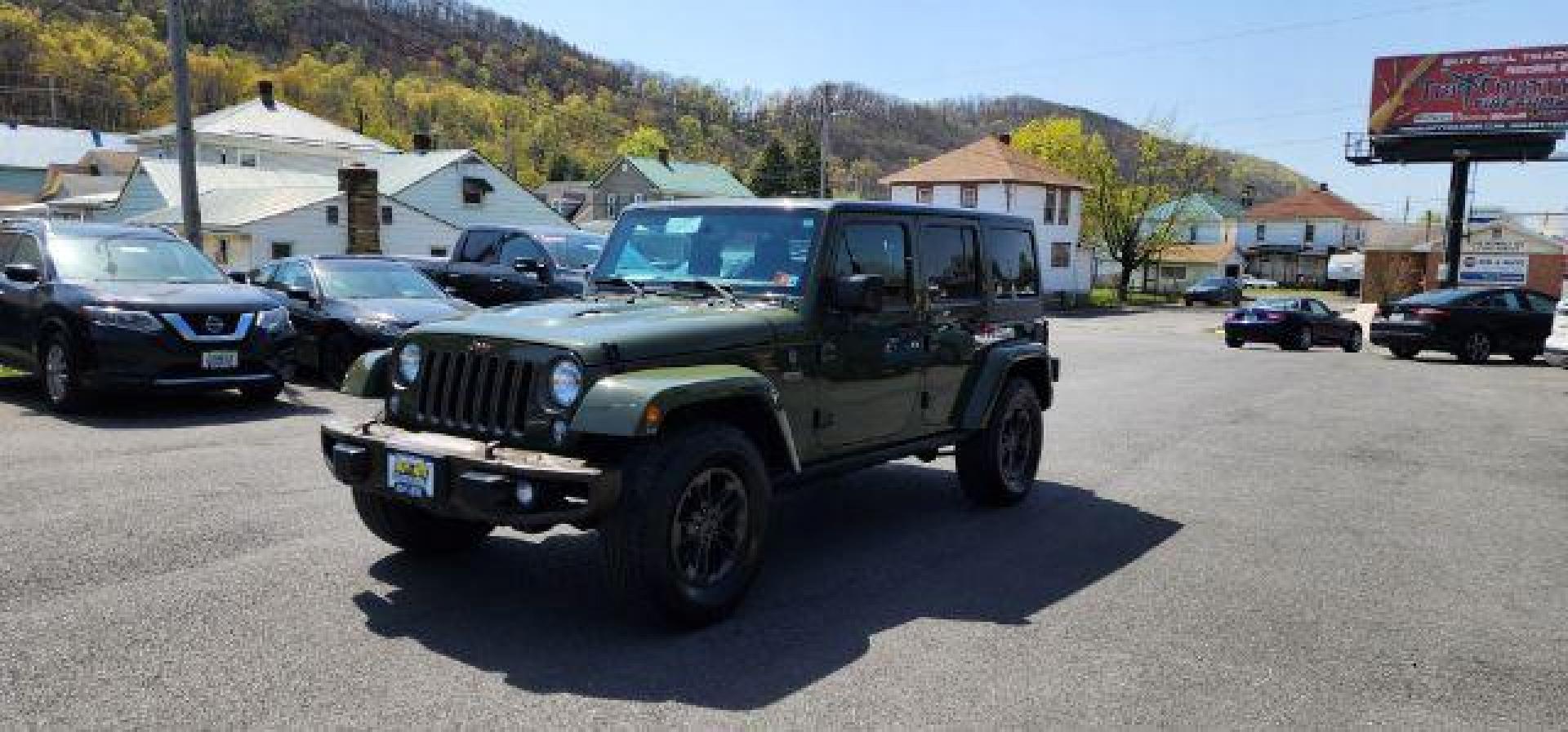 2016 GREEN /Leather Black Jeep Wrangler Unlimited Sahara 4WD (1C4BJWEG8GL) with an 3.6L V6 engine, AT transmission, located at 353 S. Mineral St., Keyser, WV, 26726, (304) 788-7887, 39.436451, -78.981674 - Photo#2