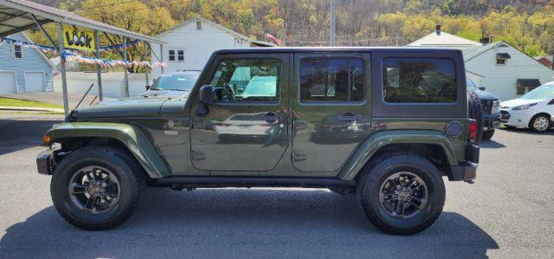 2016 GREEN /Leather Black Jeep Wrangler Unlimited Sahara 4WD (1C4BJWEG8GL) with an 3.6L V6 engine, AT transmission, located at 353 S. Mineral St., Keyser, WV, 26726, (304) 788-7887, 39.436451, -78.981674 - Photo#3