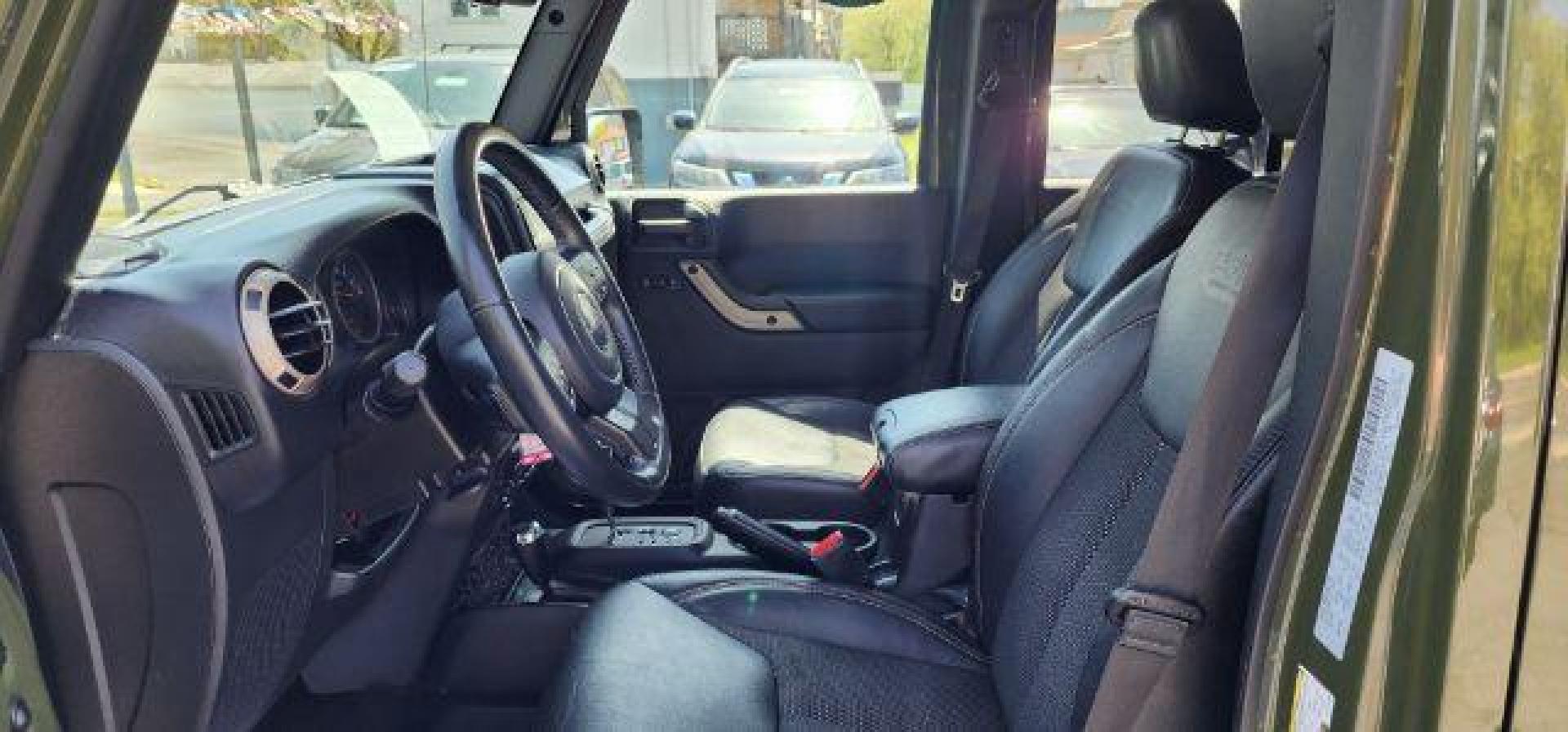 2016 GREEN /Leather Black Jeep Wrangler Unlimited Sahara 4WD (1C4BJWEG8GL) with an 3.6L V6 engine, AT transmission, located at 353 S. Mineral St., Keyser, WV, 26726, (304) 788-7887, 39.436451, -78.981674 - Photo#4