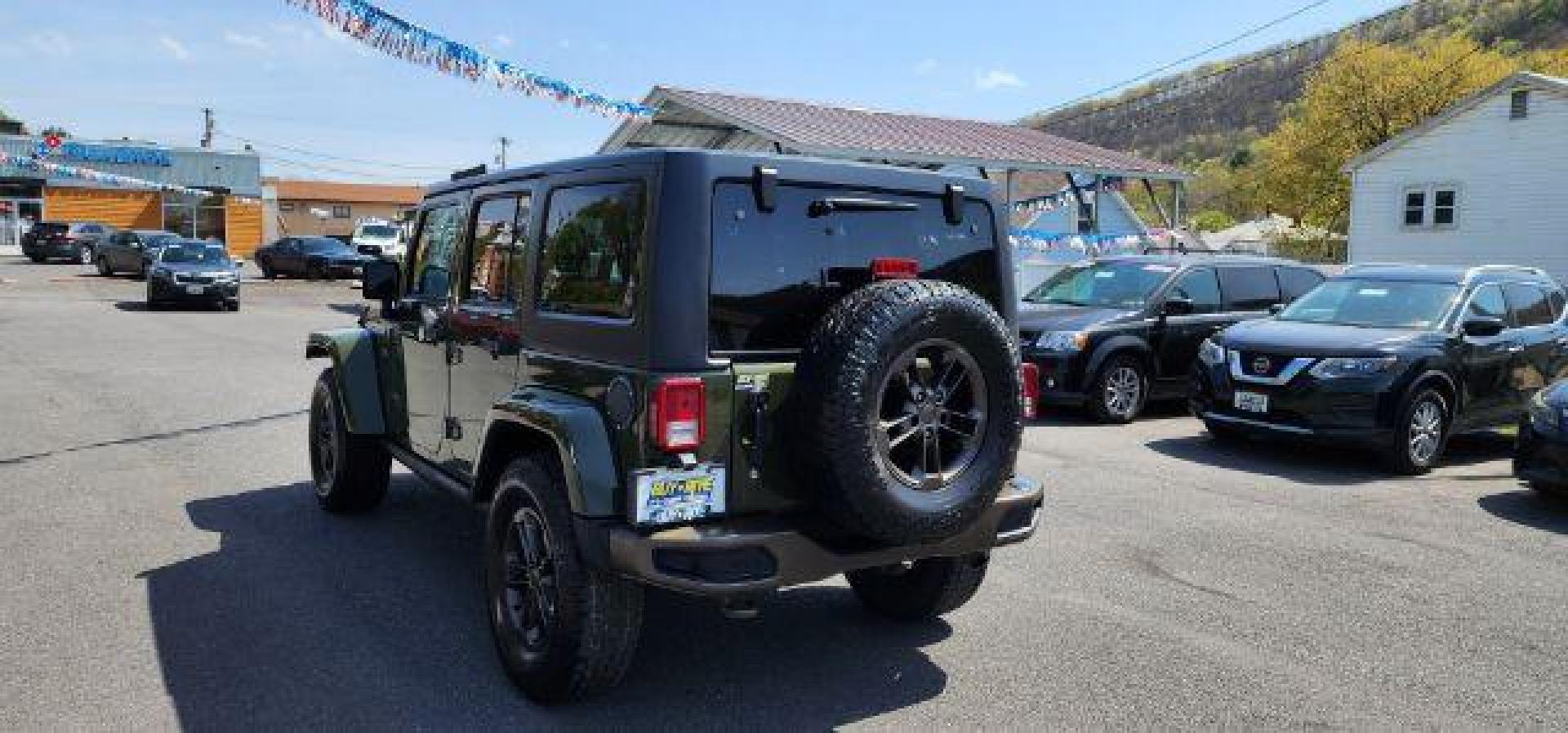 2016 GREEN /Leather Black Jeep Wrangler Unlimited Sahara 4WD (1C4BJWEG8GL) with an 3.6L V6 engine, AT transmission, located at 353 S. Mineral St., Keyser, WV, 26726, (304) 788-7887, 39.436451, -78.981674 - Photo#8