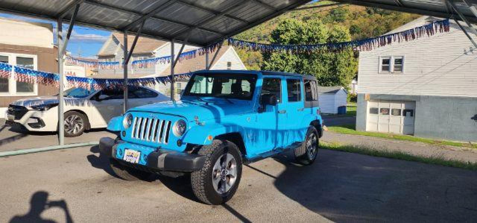 2018 BLUE /Cloth JEEP WRANGLER Unlimited Sahara 4 Door (1C4BJWEG2JL) with an 3.6L V6 engine, AT transmission, located at 353 S. Mineral St., Keyser, WV, 26726, (304) 788-7887, 39.436451, -78.981674 - Photo#2