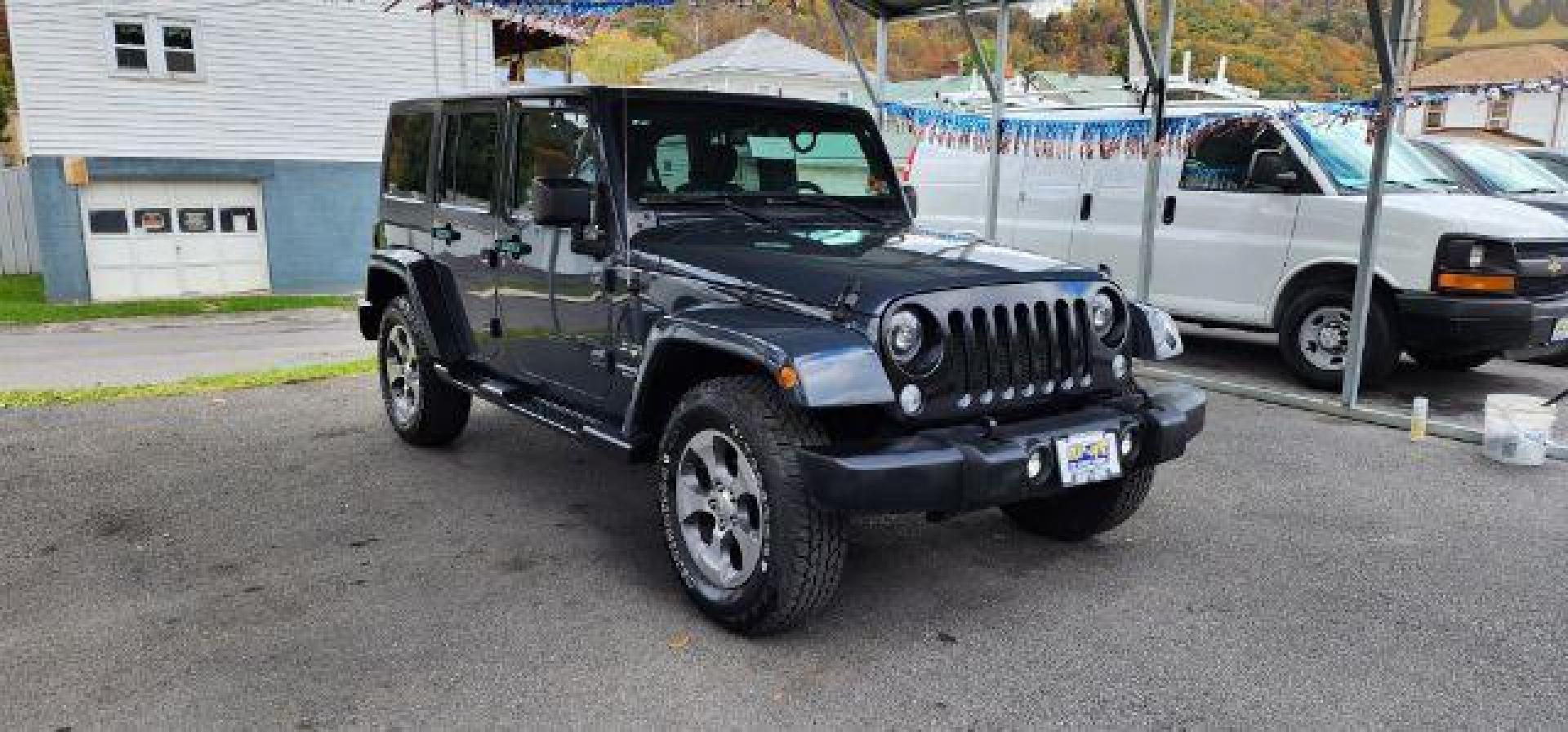 2017 GRAY /Black Jeep Wrangler Unlimited Sahara 4x4 (1C4BJWEG8HL) with an 3.6L V6 engine, 6 Speed transmission, located at 353 S. Mineral St., Keyser, WV, 26726, (304) 788-7887, 39.436451, -78.981674 - Photo#0