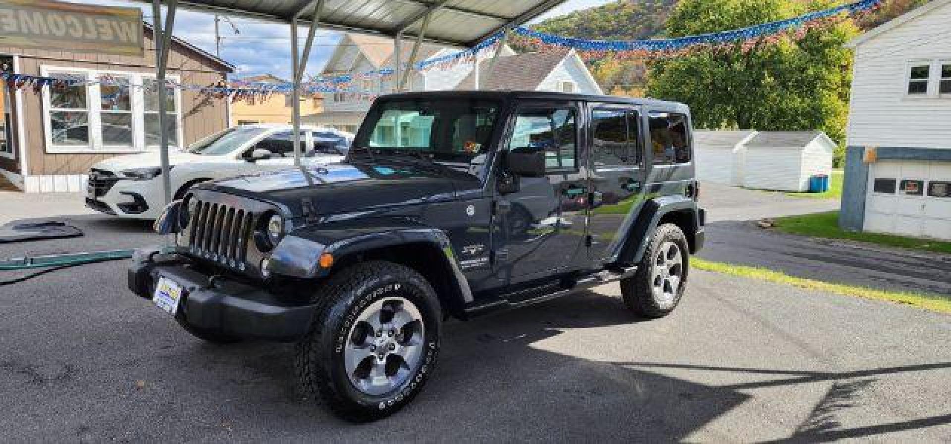 2017 GRAY /Black Jeep Wrangler Unlimited Sahara 4x4 (1C4BJWEG8HL) with an 3.6L V6 engine, 6 Speed transmission, located at 353 S. Mineral St., Keyser, WV, 26726, (304) 788-7887, 39.436451, -78.981674 - Photo#2