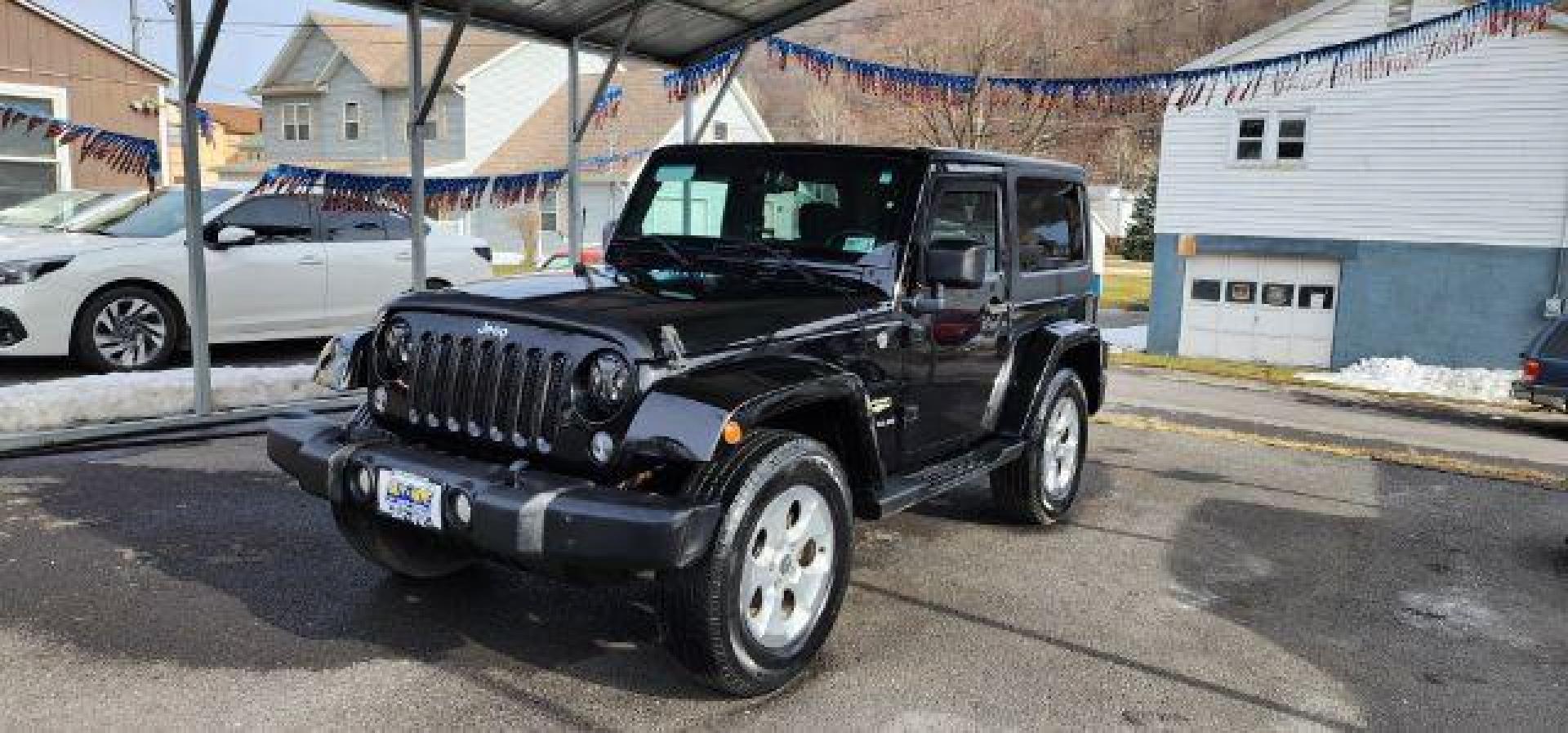 2014 BLACK Jeep Wrangler Sahara (1C4AJWBG8EL) with an 3.6L V6 engine, AT transmission, located at 353 S. Mineral St., Keyser, WV, 26726, (304) 788-7887, 39.436451, -78.981674 - Photo#2