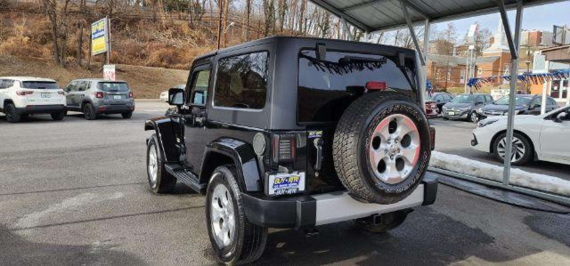 2014 BLACK Jeep Wrangler Sahara (1C4AJWBG8EL) with an 3.6L V6 engine, AT transmission, located at 353 S. Mineral St., Keyser, WV, 26726, (304) 788-7887, 39.436451, -78.981674 - Photo#8