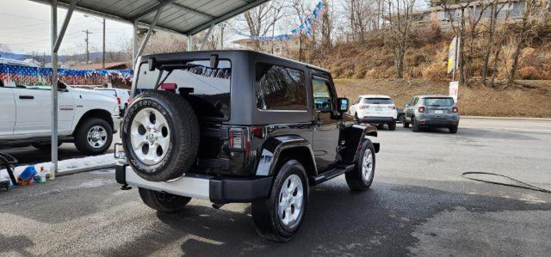2014 BLACK Jeep Wrangler Sahara (1C4AJWBG8EL) with an 3.6L V6 engine, AT transmission, located at 353 S. Mineral St., Keyser, WV, 26726, (304) 788-7887, 39.436451, -78.981674 - Photo#11