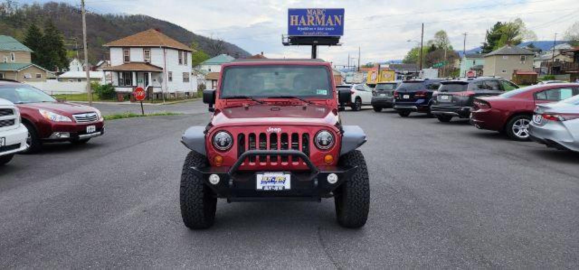 2012 RED /Black Jeep Wrangler Unlimited Sport (1C4BJWDG3CL) with an 3.6L V6 engine, AT transmission, located at 353 S. Mineral St., Keyser, WV, 26726, (304) 788-7887, 39.436451, -78.981674 - Photo#1