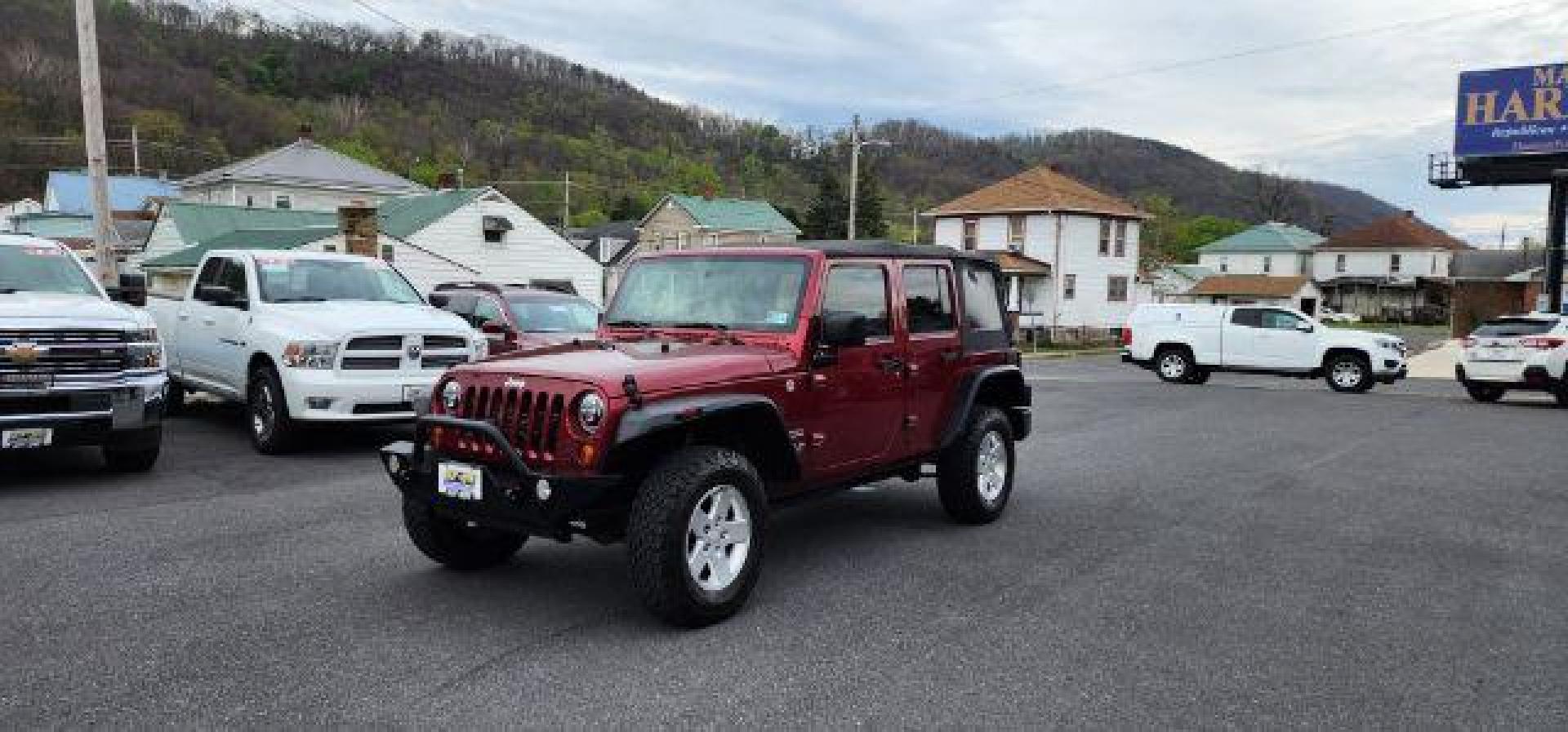 2012 RED /Black Jeep Wrangler Unlimited Sport (1C4BJWDG3CL) with an 3.6L V6 engine, AT transmission, located at 353 S. Mineral St., Keyser, WV, 26726, (304) 788-7887, 39.436451, -78.981674 - Photo#2