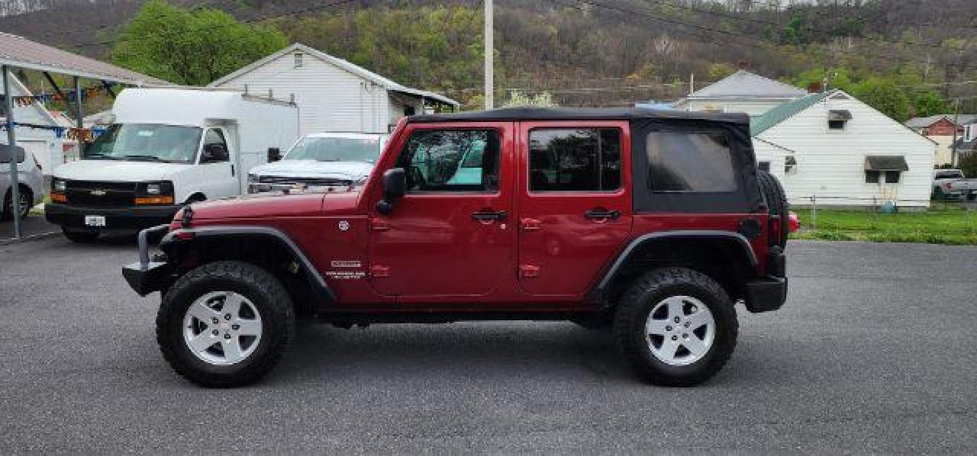 2012 RED /Black Jeep Wrangler Unlimited Sport (1C4BJWDG3CL) with an 3.6L V6 engine, AT transmission, located at 353 S. Mineral St., Keyser, WV, 26726, (304) 788-7887, 39.436451, -78.981674 - Photo#3