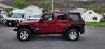 2012 RED /Black Jeep Wrangler Unlimited Sport (1C4BJWDG3CL) with an 3.6L V6 engine, AT transmission, located at 353 S. Mineral St., Keyser, WV, 26726, (304) 788-7887, 39.436451, -78.981674 - Photo#3