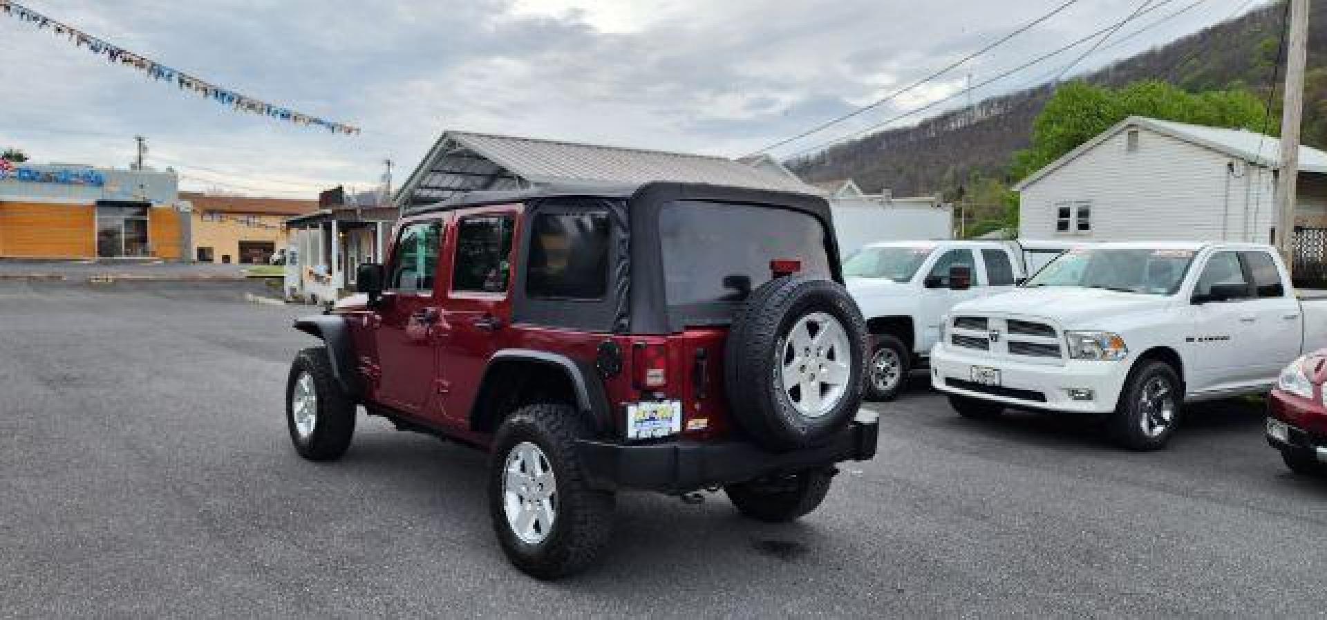 2012 RED /Black Jeep Wrangler Unlimited Sport (1C4BJWDG3CL) with an 3.6L V6 engine, AT transmission, located at 353 S. Mineral St., Keyser, WV, 26726, (304) 788-7887, 39.436451, -78.981674 - Photo#8