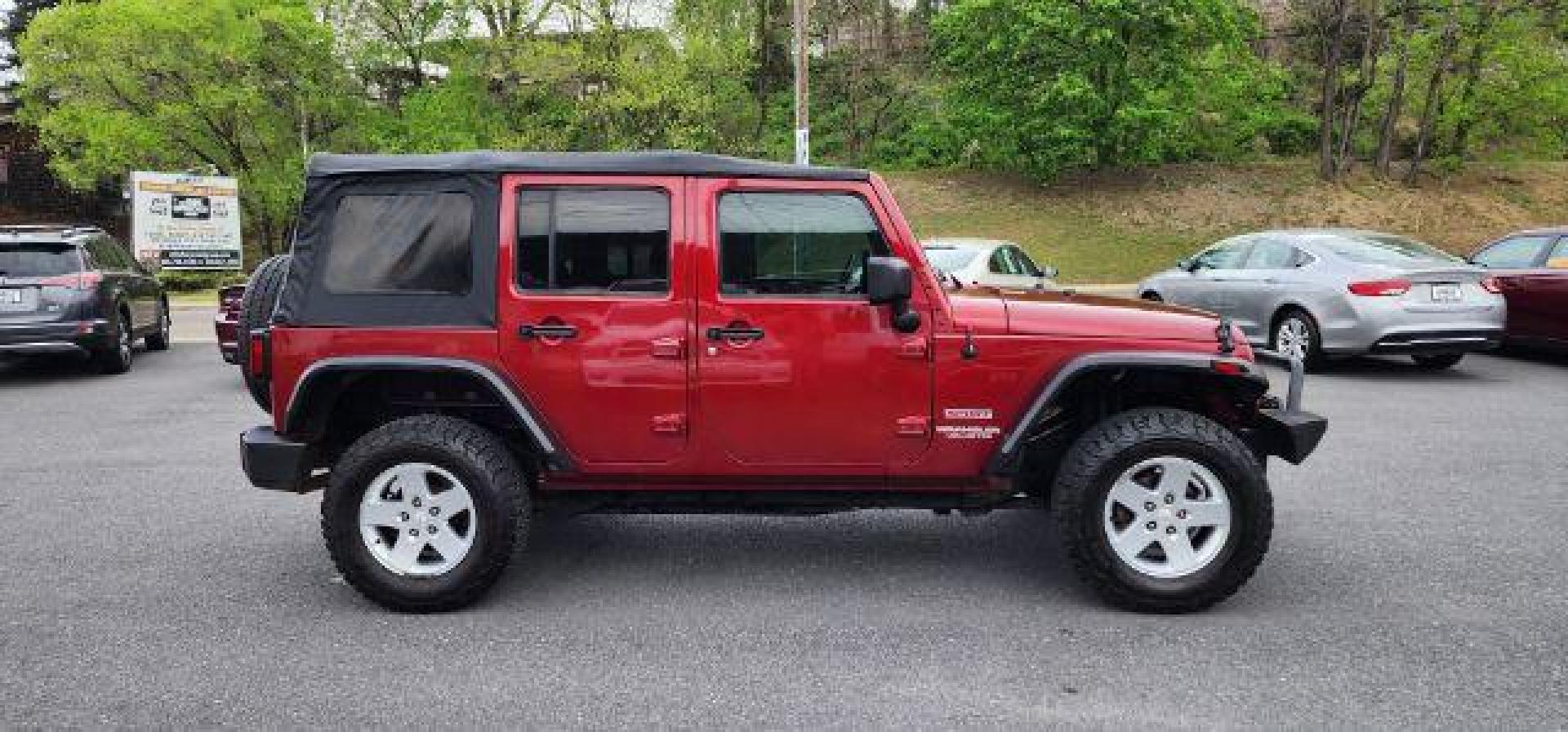 2012 RED /Black Jeep Wrangler Unlimited Sport (1C4BJWDG3CL) with an 3.6L V6 engine, AT transmission, located at 353 S. Mineral St., Keyser, WV, 26726, (304) 788-7887, 39.436451, -78.981674 - Photo#12