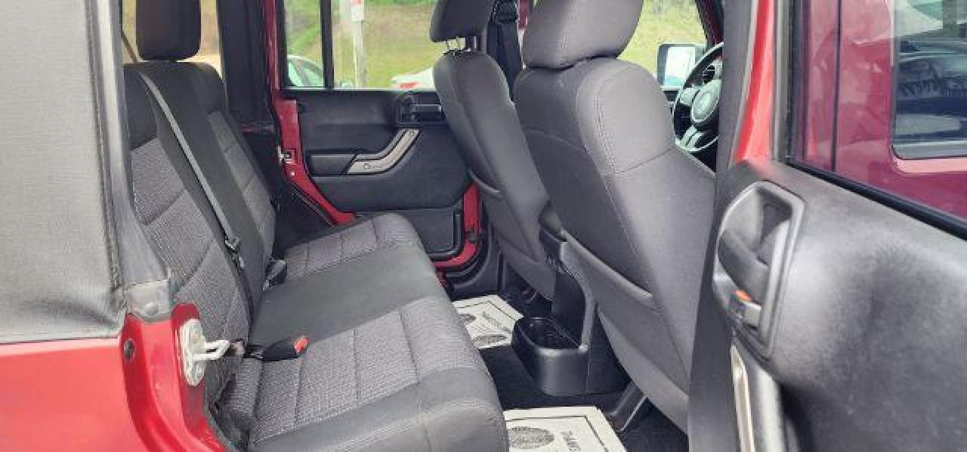 2012 RED /Black Jeep Wrangler Unlimited Sport (1C4BJWDG3CL) with an 3.6L V6 engine, AT transmission, located at 353 S. Mineral St., Keyser, WV, 26726, (304) 788-7887, 39.436451, -78.981674 - Photo#13