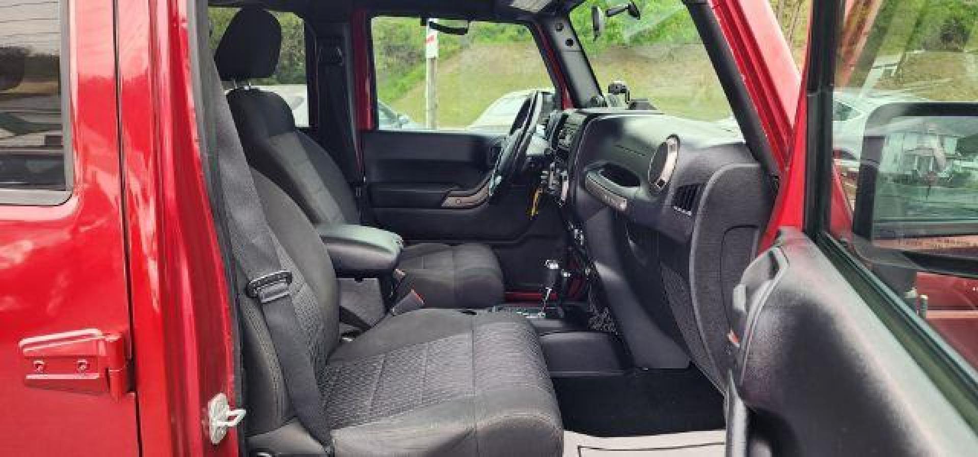 2012 RED /Black Jeep Wrangler Unlimited Sport (1C4BJWDG3CL) with an 3.6L V6 engine, AT transmission, located at 353 S. Mineral St., Keyser, WV, 26726, (304) 788-7887, 39.436451, -78.981674 - Photo#14