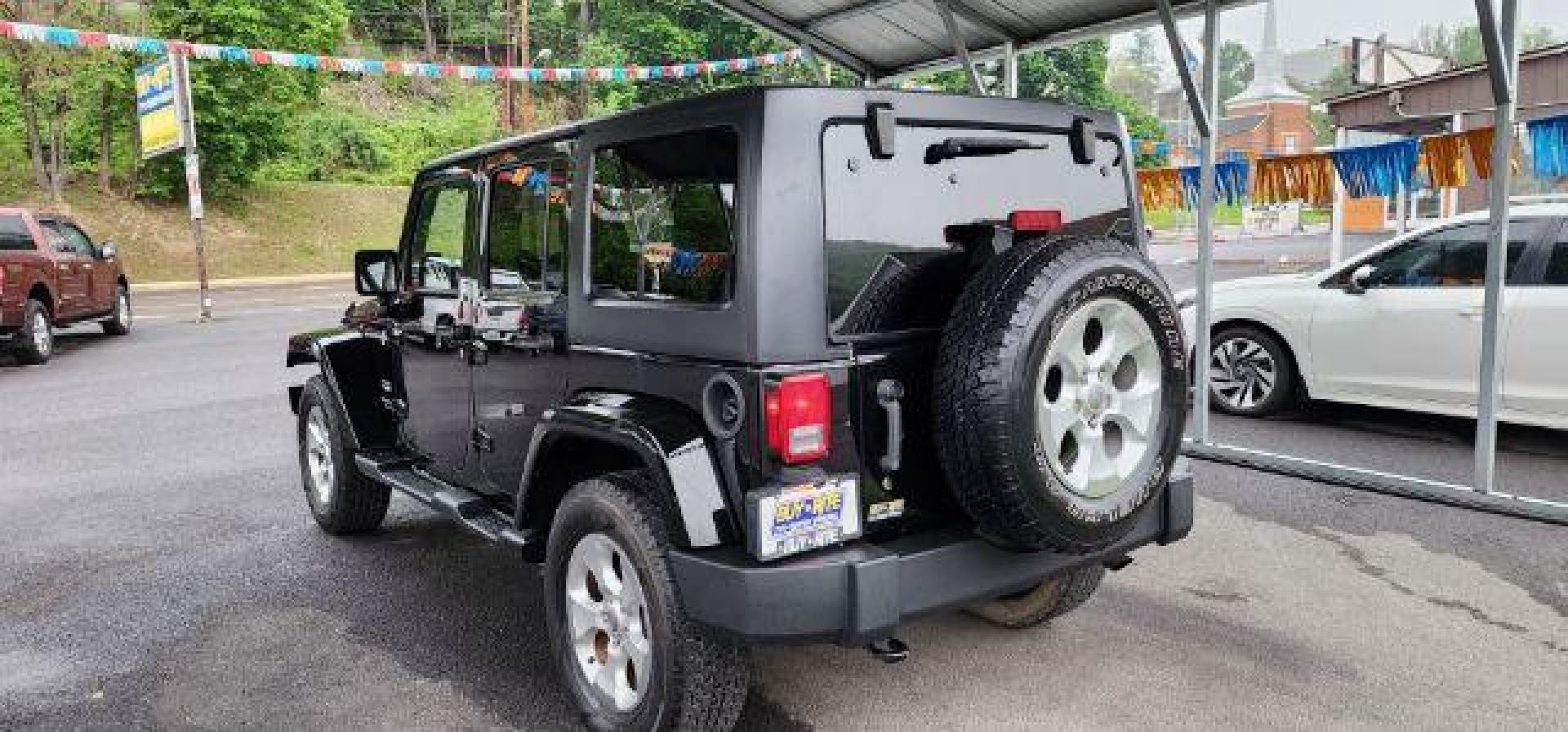 2015 BLACK /Dark Saddle/Black Jeep Wrangler Unlimited Sahara (1C4BJWEG2FL) with an 3.6L V6 engine, AT transmission, located at 353 S. Mineral St., Keyser, WV, 26726, (304) 788-7887, 39.436451, -78.981674 - Photo#8