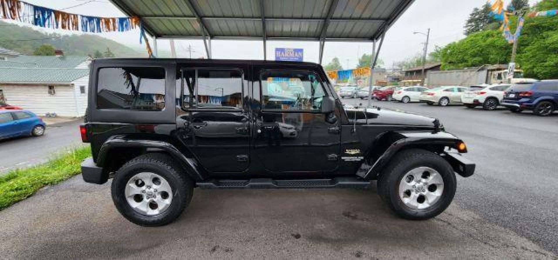 2015 BLACK /Dark Saddle/Black Jeep Wrangler Unlimited Sahara (1C4BJWEG2FL) with an 3.6L V6 engine, AT transmission, located at 353 S. Mineral St., Keyser, WV, 26726, (304) 788-7887, 39.436451, -78.981674 - Photo#12