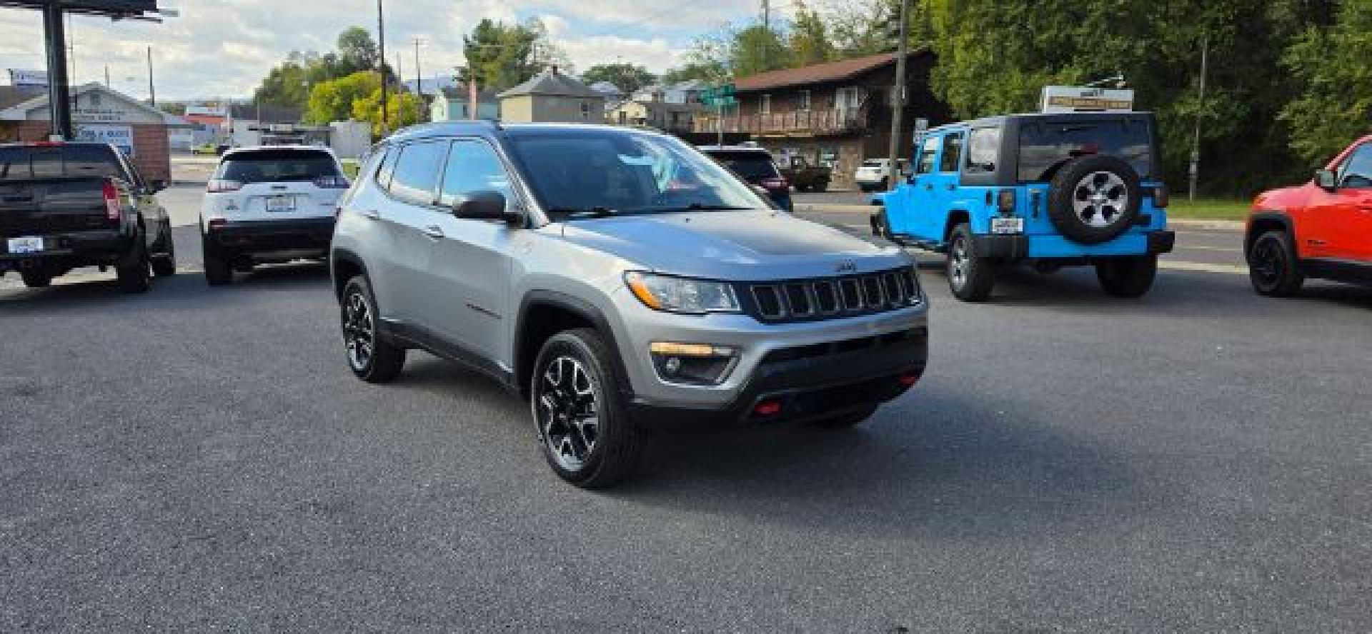 2021 SILVER /Ruby Red/Black Jeep Compass Trailhawk 4x4 (3C4NJDDB1MT) with an 2.4L L4 engine, AT transmission, located at 353 S. Mineral St., Keyser, WV, 26726, (304) 788-7887, 39.436451, -78.981674- Photo#0
