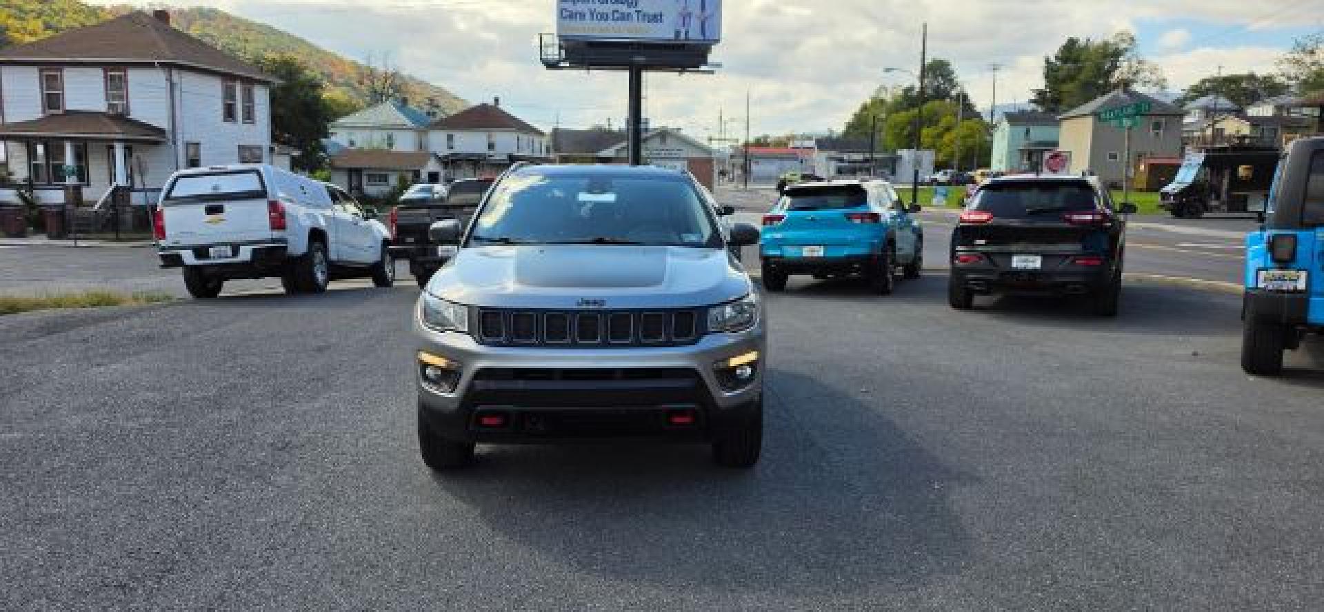 2021 SILVER /Ruby Red/Black Jeep Compass Trailhawk 4x4 (3C4NJDDB1MT) with an 2.4L L4 engine, AT transmission, located at 353 S. Mineral St., Keyser, WV, 26726, (304) 788-7887, 39.436451, -78.981674- Photo#1