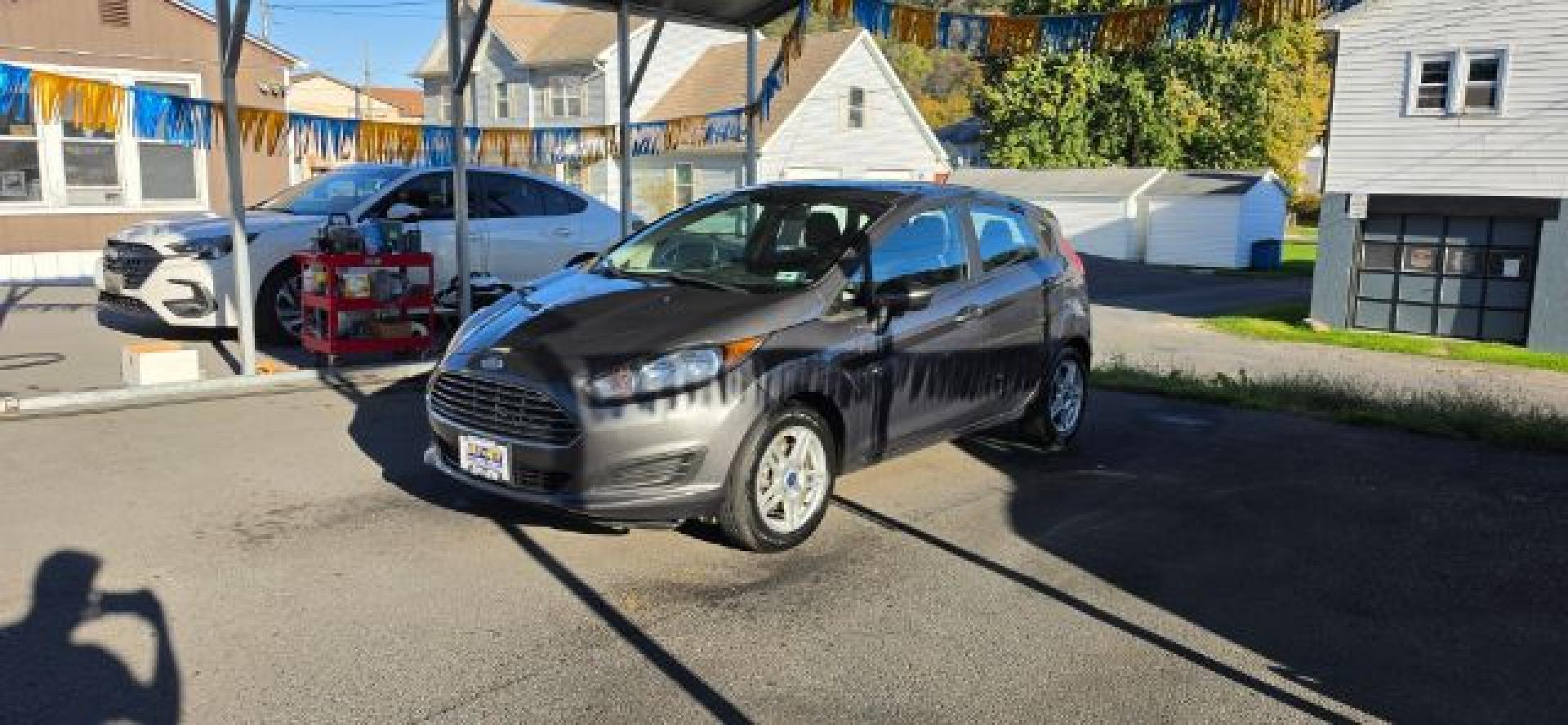 2017 GRAY /Medium Light Stone Ford Fiesta SE (3FADP4EJ0HM) with an 1.6L L4 engine, AT transmission, located at 353 S. Mineral St., Keyser, WV, 26726, (304) 788-7887, 39.436451, -78.981674- Photo#2
