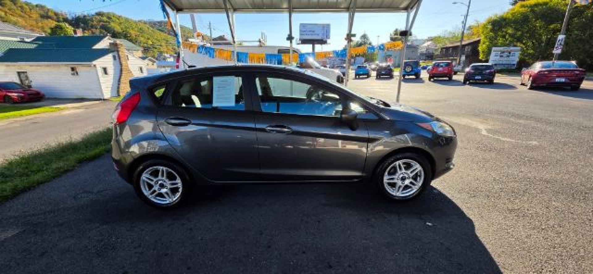 2017 GRAY /Medium Light Stone Ford Fiesta SE (3FADP4EJ0HM) with an 1.6L L4 engine, AT transmission, located at 353 S. Mineral St., Keyser, WV, 26726, (304) 788-7887, 39.436451, -78.981674- Photo#12